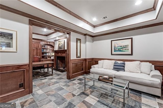 living room featuring crown molding