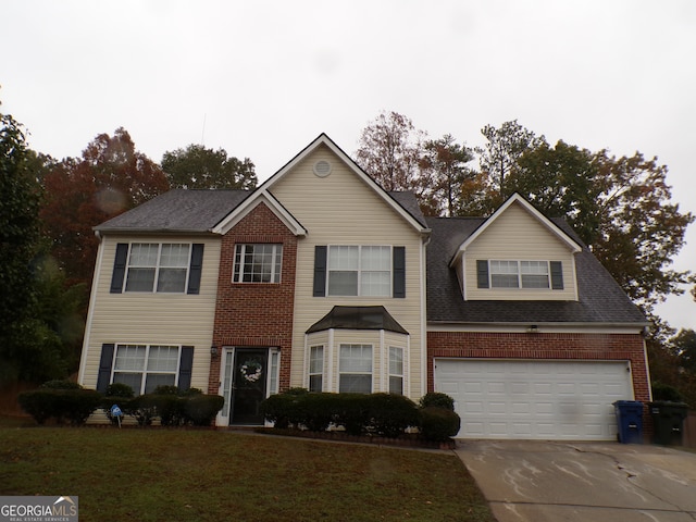 view of front of home featuring a garage and a front yard