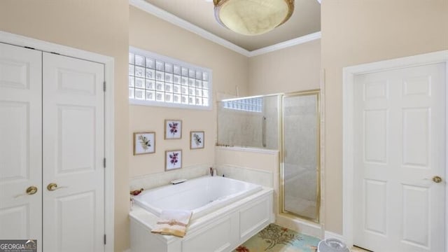 bathroom featuring separate shower and tub and ornamental molding