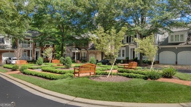 view of front of house with a front lawn and a garage