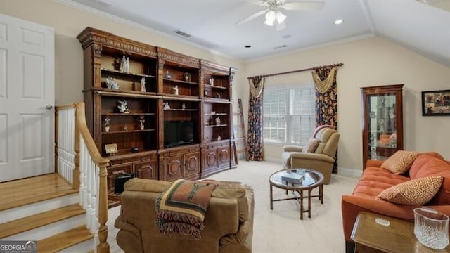 sitting room featuring lofted ceiling, crown molding, light carpet, and ceiling fan