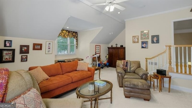 living room with ornamental molding, light carpet, lofted ceiling, and ceiling fan