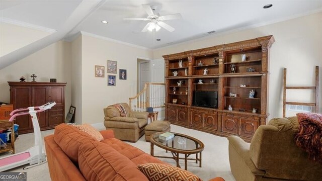 living room with light carpet, crown molding, and ceiling fan