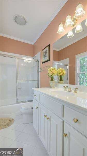 full bathroom featuring shower / bath combination with glass door, toilet, ornamental molding, vanity, and tile patterned floors