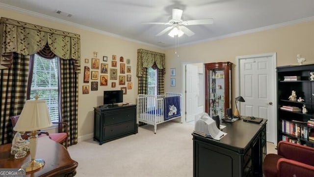 office space featuring crown molding, light carpet, and ceiling fan