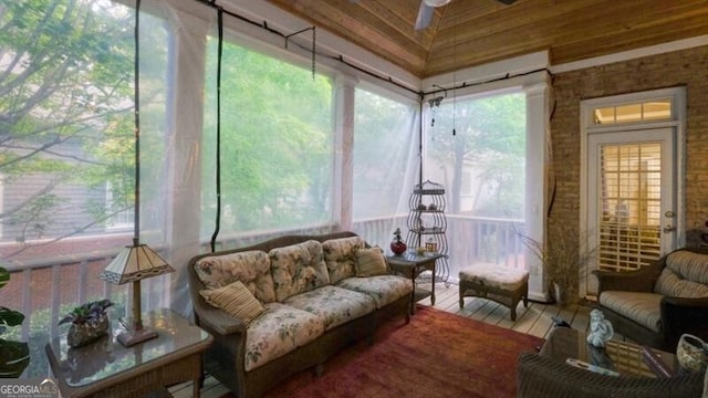 sunroom / solarium featuring ceiling fan and plenty of natural light