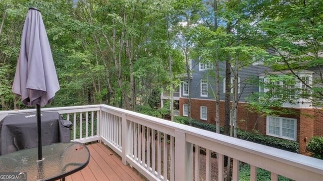 wooden deck featuring area for grilling