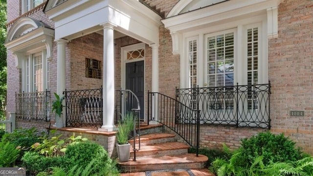 view of exterior entry featuring a porch