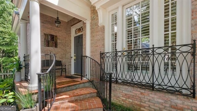 view of exterior entry with covered porch