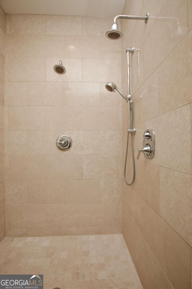 bathroom with a tile shower