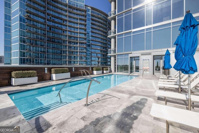 view of swimming pool featuring a patio