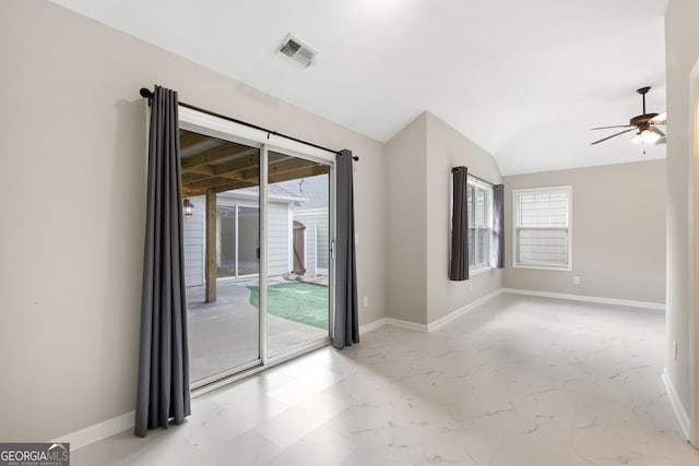 unfurnished room featuring ceiling fan and vaulted ceiling