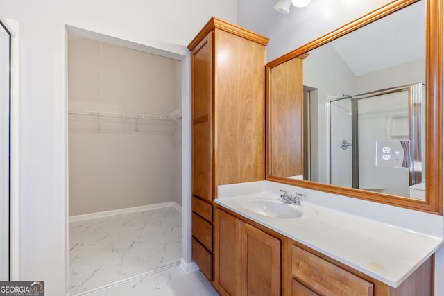 bathroom with vanity, an enclosed shower, and vaulted ceiling