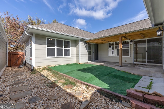 rear view of house with a patio