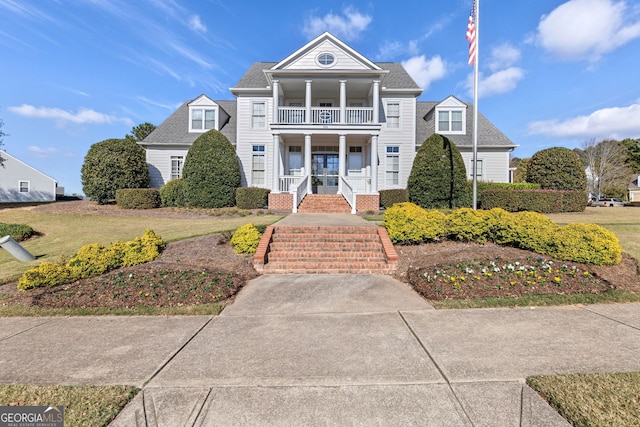 view of front of house featuring covered porch and a balcony