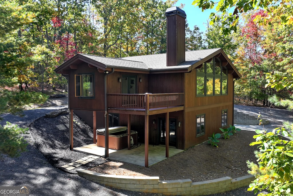 rear view of house featuring a patio