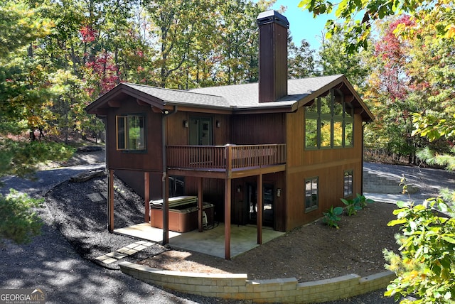 rear view of house featuring a patio