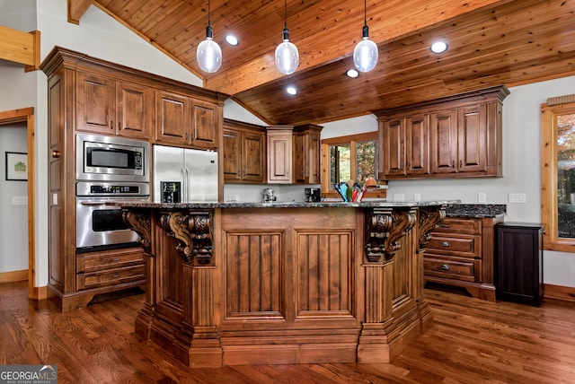 kitchen with stainless steel appliances, dark stone countertops, dark wood-type flooring, pendant lighting, and lofted ceiling with beams