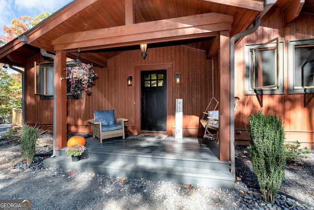 entrance to property with a wooden deck