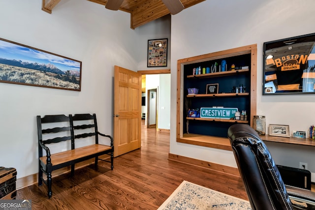 home office with dark wood-type flooring, beamed ceiling, high vaulted ceiling, and wooden ceiling