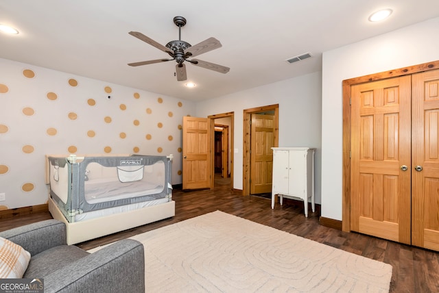 bedroom with ceiling fan and dark hardwood / wood-style flooring