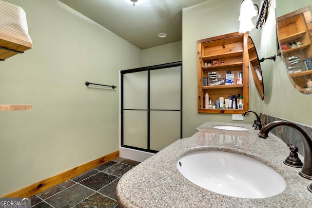 bathroom featuring walk in shower and vanity