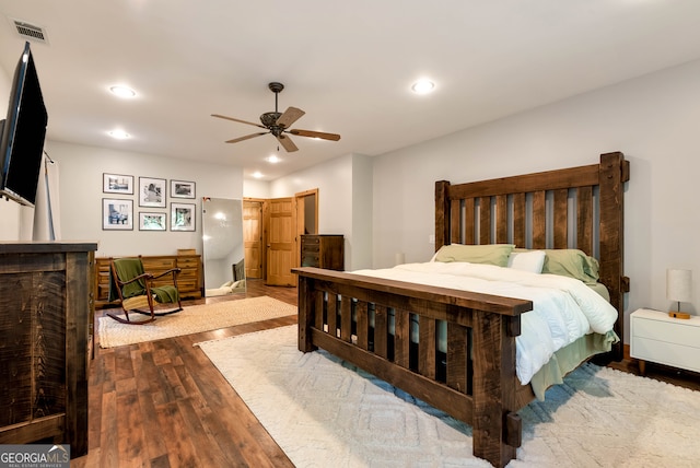 bedroom featuring ceiling fan and dark hardwood / wood-style flooring