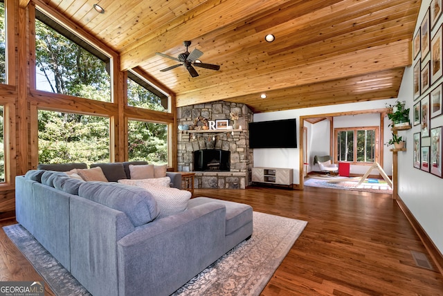 living room featuring dark hardwood / wood-style flooring, wood ceiling, high vaulted ceiling, beam ceiling, and a fireplace