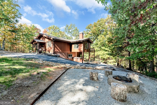 view of front facade with a fire pit