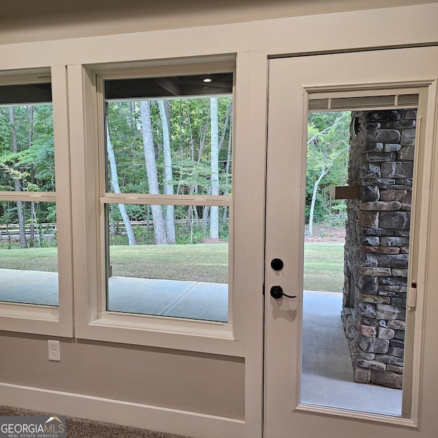 entryway with french doors and carpet