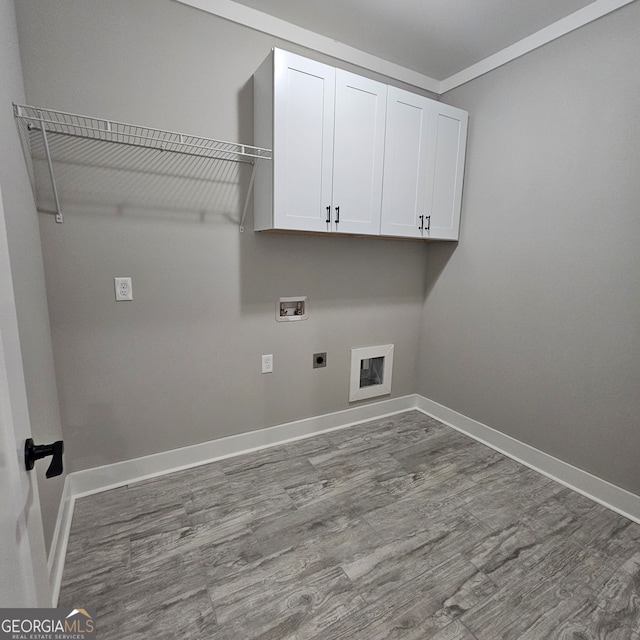 laundry area with light hardwood / wood-style flooring, electric dryer hookup, washer hookup, and cabinets