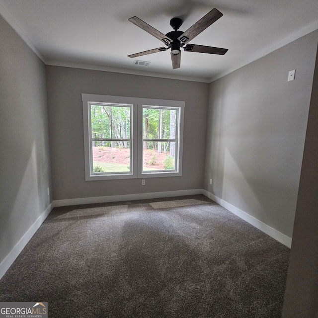 carpeted empty room with crown molding and ceiling fan