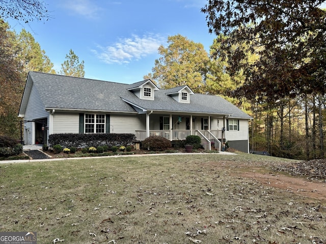 view of front of house with a porch and a front yard