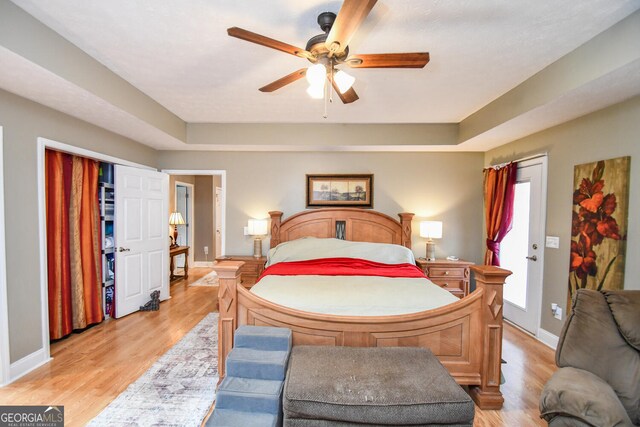 bedroom featuring light hardwood / wood-style flooring and ceiling fan