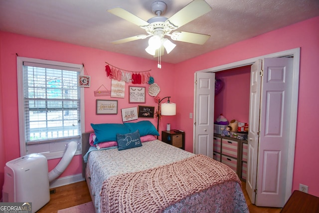 bedroom featuring wood-type flooring and ceiling fan