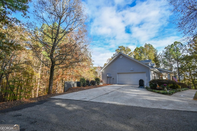 view of side of home with a garage