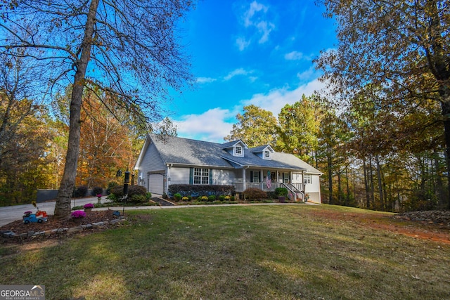 cape cod house with a porch, a front yard, and a garage