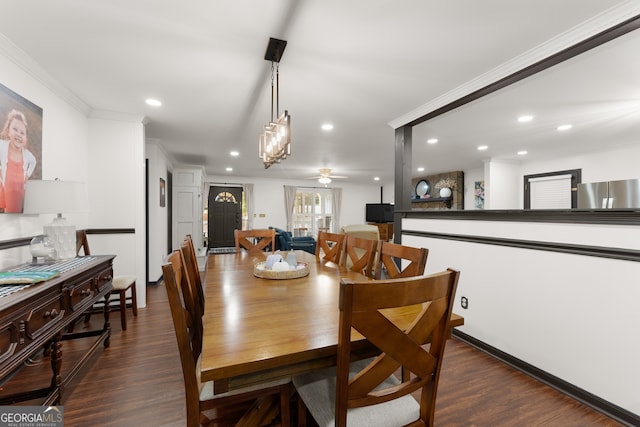 dining space featuring ceiling fan, dark hardwood / wood-style floors, and crown molding