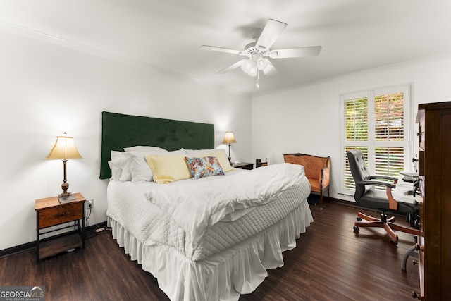 bedroom featuring dark wood-type flooring, ceiling fan, and crown molding