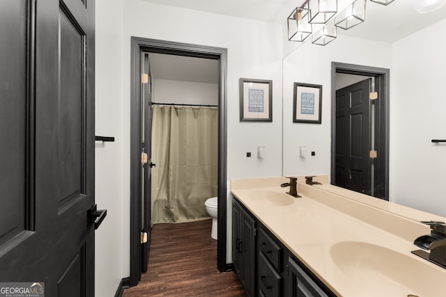 bathroom with vanity, hardwood / wood-style flooring, toilet, and a shower with shower curtain