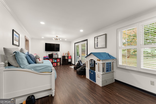 bedroom featuring dark hardwood / wood-style floors, an inviting chandelier, french doors, and ornamental molding