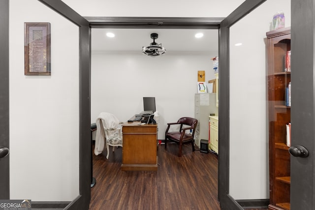 office area with dark wood-type flooring and crown molding