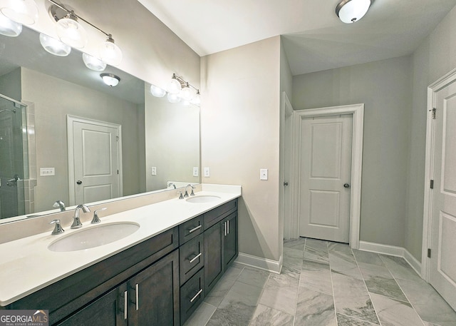 bathroom with vanity and a shower with shower door