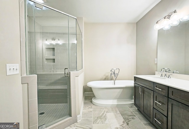 bathroom featuring vanity and separate shower and tub