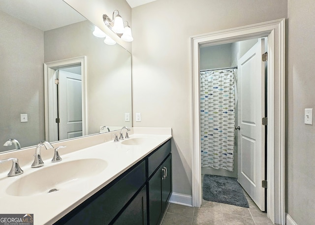 bathroom featuring vanity, tile patterned floors, and curtained shower