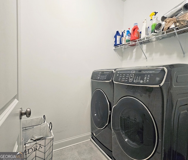 laundry room with separate washer and dryer