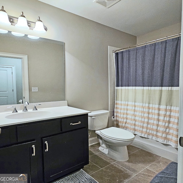 full bathroom with toilet, vanity, tile patterned floors, and shower / bathtub combination with curtain