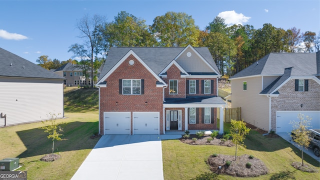 view of front facade featuring a garage and a front lawn