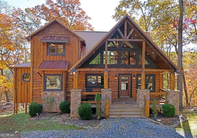 log cabin with a porch