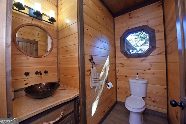 bathroom featuring hardwood / wood-style floors, wood walls, toilet, and wood ceiling